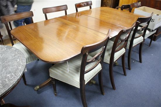 A Regency design mahogany twin pillar extending dining table W.190cm extended (one spare leaf)